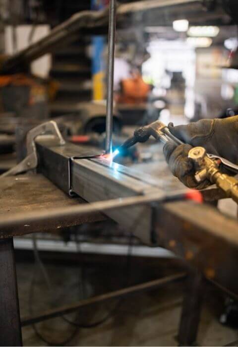 engineer welding iron fences